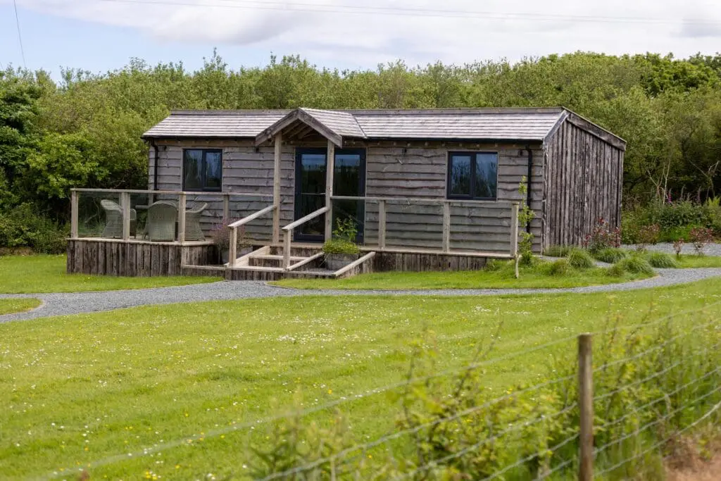 Countryside lodge accommodation at Little Pig Wellness in North Cornwall, designed for restorative stays